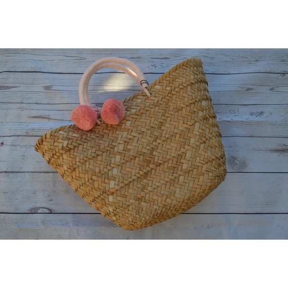 KAYU Tropez straw tote with pink pom-poms